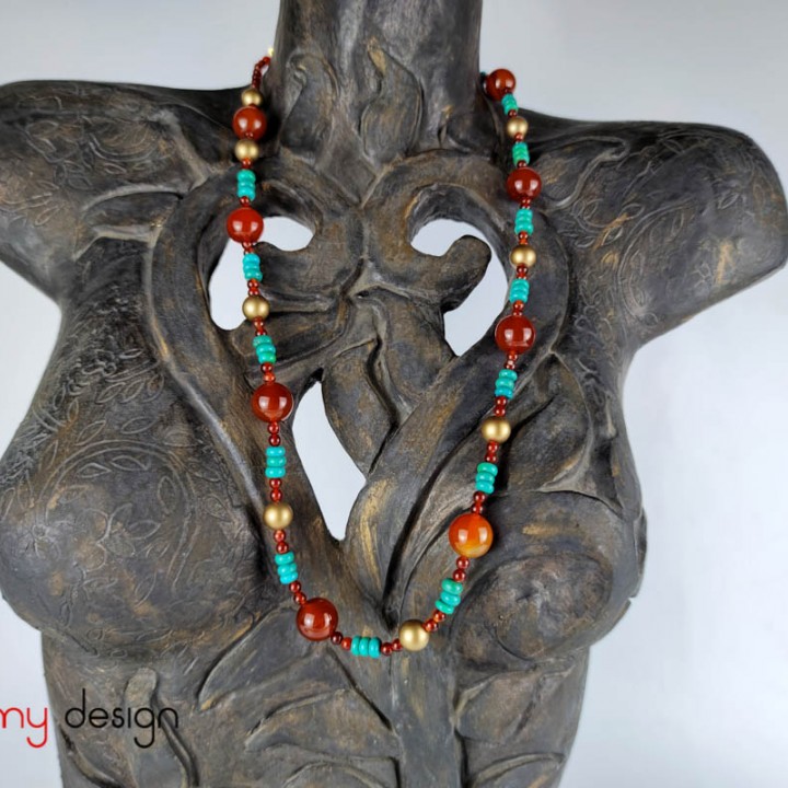 Necklace designed with a combination of lithium beads and large red stone beads