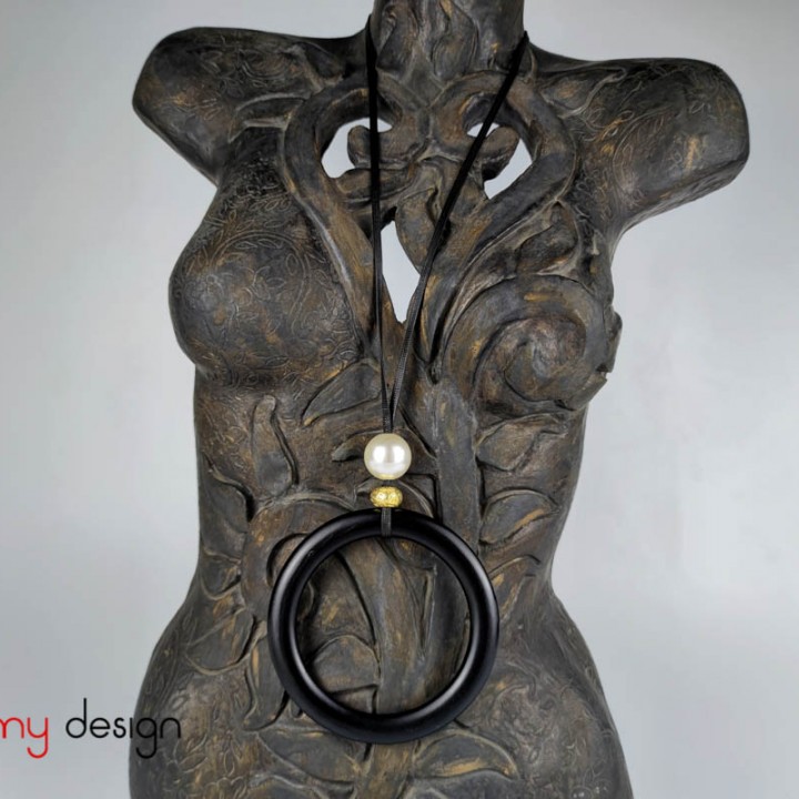 Necklace designed with round wooden pendant and metal