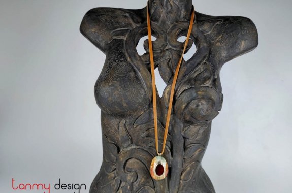 Necklace designed with leather strap, stone pendant attached with silver