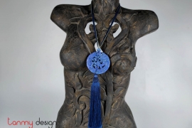 Necklace designed with round pendant and tassel