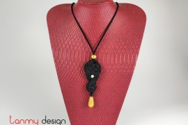 Necklace designed with black cotton pendant