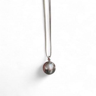 Necklace designed with silver round ball  pendant and the leather cord