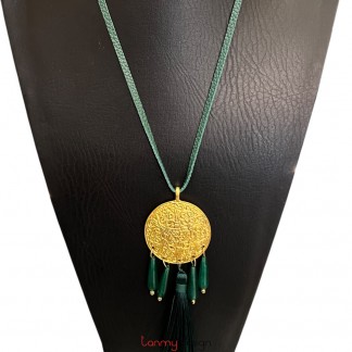 Necklace designed with gold-plated metal, black tassels and the green teardrop-shaped agate
