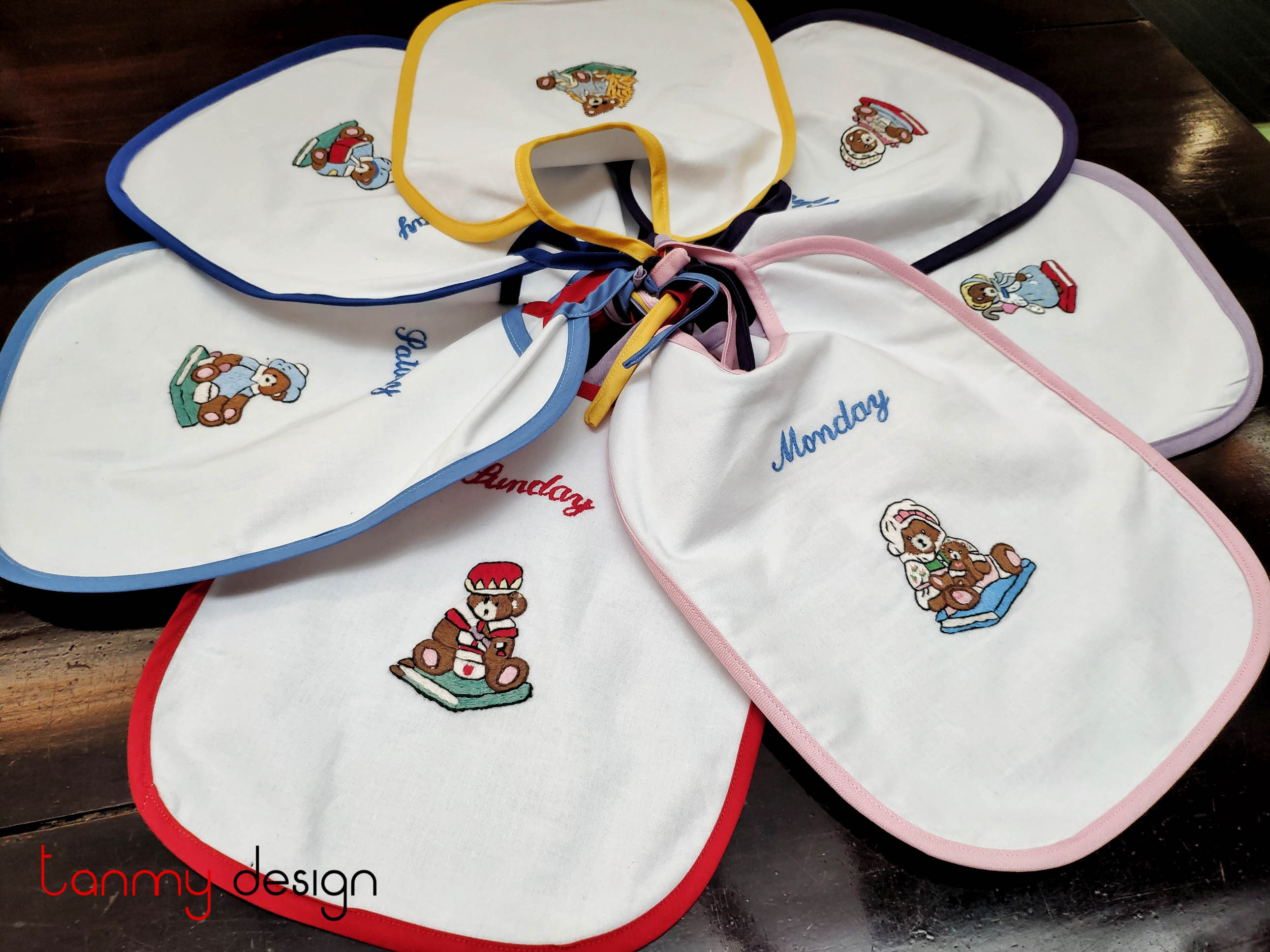 Set of 7 English embroidered baby bibs