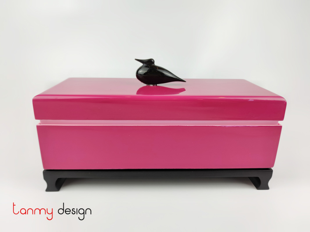Pink rectangular box attached with small horn bird included with stand 