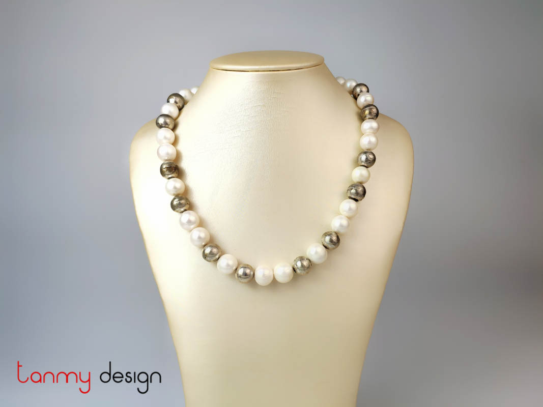 Large pearl necklace designed with large round silver